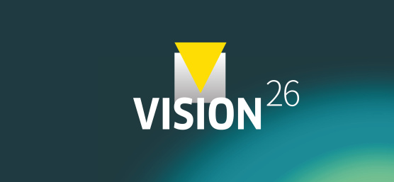 青緑色の背景に「VISION26」の文字が入ったグラフィック。